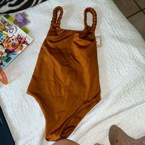 One piece from miami boutique Maheli heli size small bronze